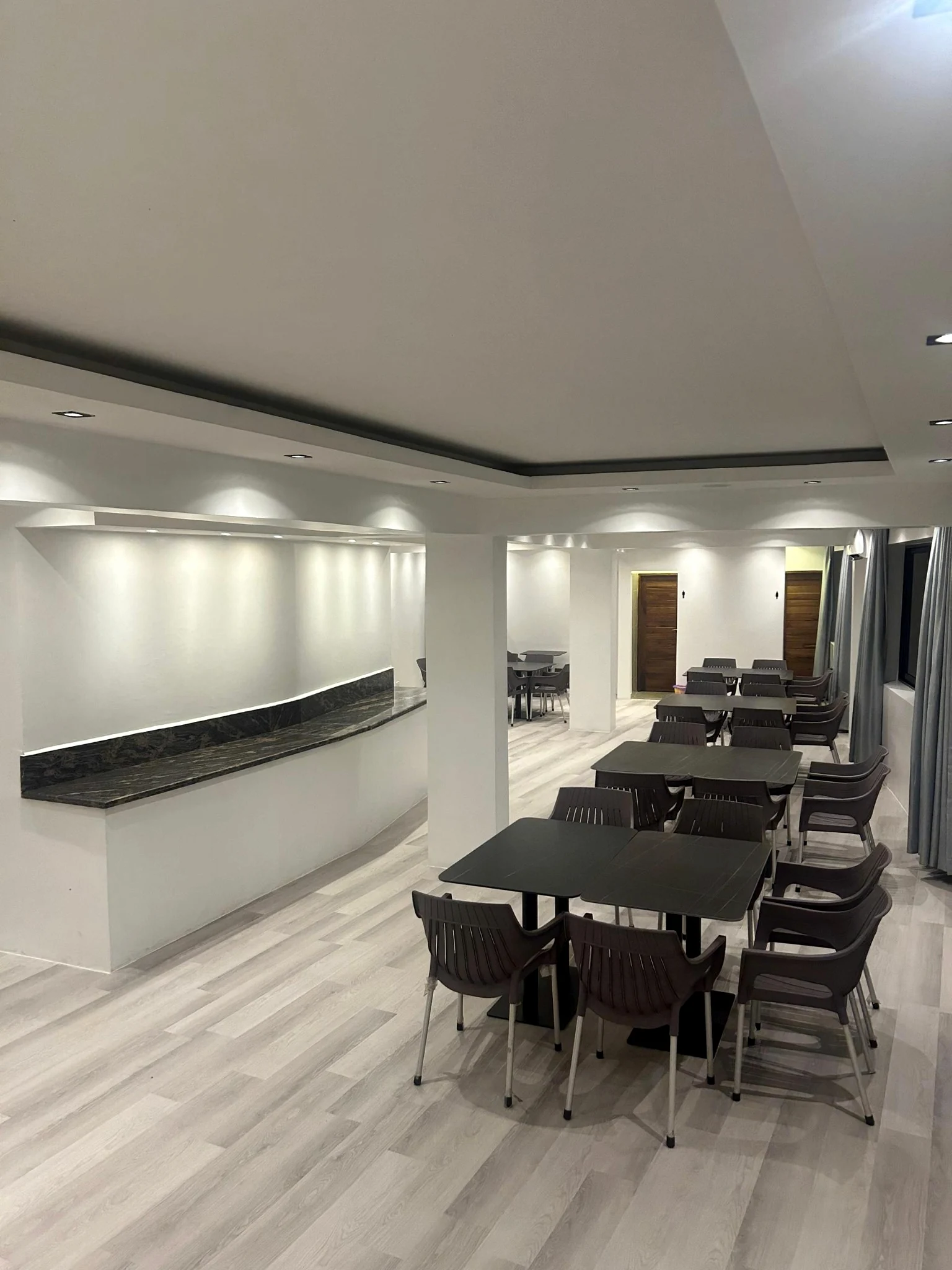 Genuine Salaam Hall interior showing its white ceiling, dark tables, grey seating and buffet counter
